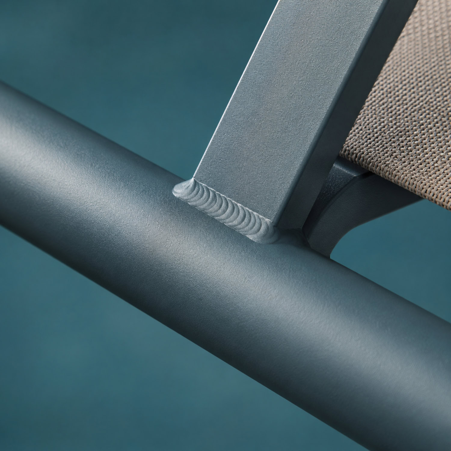 Close-up of a powder-coated aluminum lounger frame and welded joint